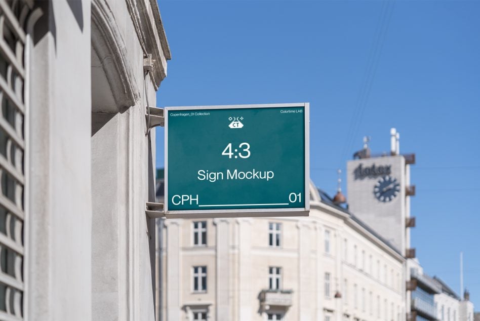 Teal sign mockup on urban street with historic clock tower visible